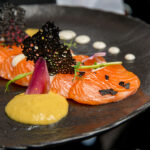 Citrus-marinated salmon sashimi with herb yogurt sauce and guacamole